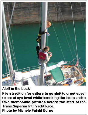 Aloft in the Lock It is a tradition for sailors to go aloft to greet spectators at eye-level while transiting the locks and to take memorable pictures before the start of the Trans Superior Int’l Yacht Race. Photo by Michele Pufahl-Burns