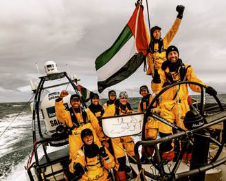 Azzam's sailors send their wishes home as they hold up a 'Hi Abu Dhabi' message in Arabic to mark their momentous rounding of Cape Horn. (Image: Matt Knighton, ADOR)