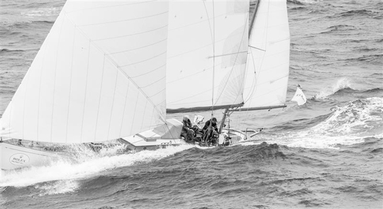 S&S 52 Yawl DORADE - two-time winner of the race in the 1930s - at the Fastnet rock