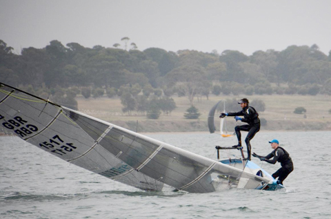 McGrane and Hughes checking out centerboard and weed problems in Race 1. Credit - Rhenny Cunningham - Sailing Shots