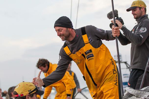 Abu Dhabi Ocean Racing skipper Ian Walker is a picture of elation as he is congratulated on the Lorient docks.