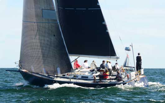 Vamp, a J44 skippered by Lenny Siter, Crewman AJ Evans, Chairman of the 2016 Bermuda Race and watch captain, reported today that they had passed through the weather front and were sailing at 10knots under spinnaker. Photo: Talbot Wilson/PPL