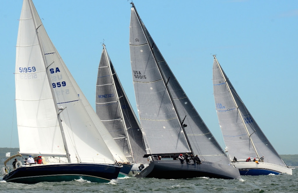 'Jambi', [50015] a new Hinckley Bermuda 50 skippered by John Levinson crossed the finish line off St. Davids Lighthouse at 12:47:00 ADT to take line honors in the 40th Anniversary Marion Bermuda Race. 'Jambi' had an unofficial elapsed time of 4 days 22 hours 52 minutes 11 seconds. Based on her starting time of 12:55 EDT on June 9, that is 118 hours 52 minutes and 11 Seconds. - Photo by Talbot Wilson