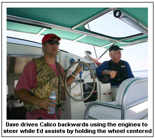 Dave drives Calico backwards using the engines to steer while Ed assists by holding the wheel centered