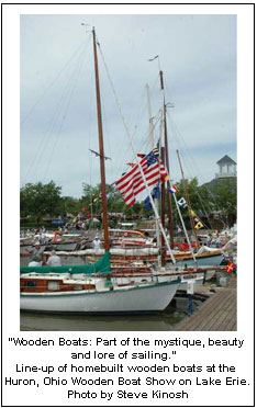 “Wooden Boats: Part of the mystique, beauty and lore of sailing.”  Line-up of homebuilt wooden boats at the Huron, Ohio Wooden Boat Show on Lake Erie. Photo by Steve Kinosh