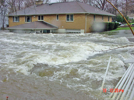 Photograph looking downstream from the bridge at the gaging station on the Hackensack River at Rivervale, New jersey (USGS downstream order number 01377000), a few hours after the flood peak on April 16, 2007, at a stage approximately 0.3 ft less than the peak.