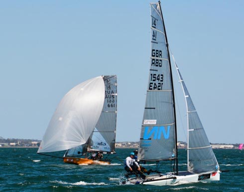 Britains Glen Truswell holds out Australias Brad Devine in Race 4 to take another race win. Credit: Rhenny Cunningham - Sailing Shots