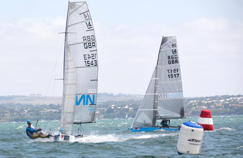Britains Glen Truswell leads close rival Ben McGrane around the blustery Corio Bay course in Race 3 of the regatta.Credit: Rhenny Cunningham - Sailing Shots