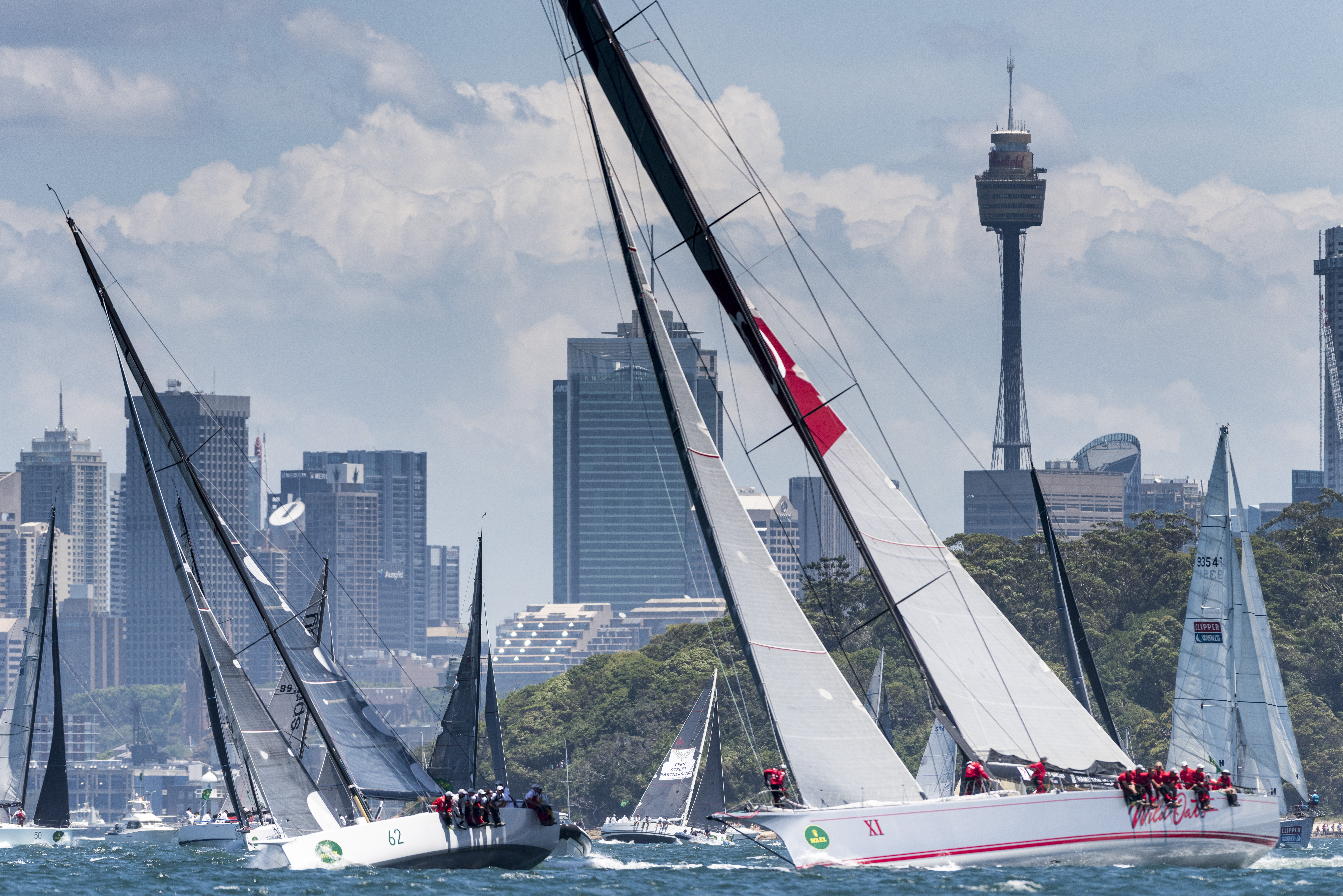 Two former race winners - WILD OATS XI and VICTOIRE - jostle for space during the 2016 Rolex Sydney Hobart race start