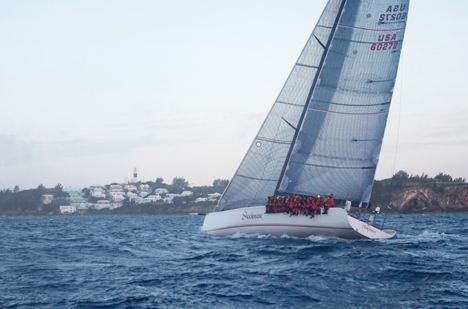 Shockwave owned by George Sakellaris, closing on the St. David's Lighthouse finish line to take line honors 7 minutes ahead of rival mini maxi Bella Mente with an elapsed time of 2days 15 hours 24 mins, 11 secs.  Photo Barry Pickthall/PPL