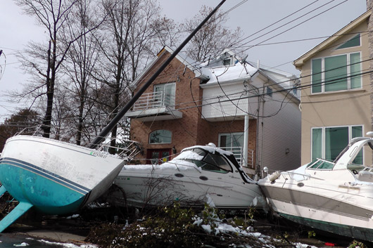 Boats tossed around in a hurricane can hamper a communitys recovery effort, like these boats that floated into streets and power lines after Hurricane Sandy.