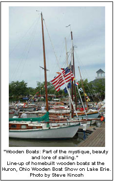 “Wooden Boats: Part of the mystique, beauty and lore of sailing.” Line-up of homebuilt wooden boats at the Huron, Ohio Wooden Boat Show on Lake Erie. Photo by Steve Kinosh
