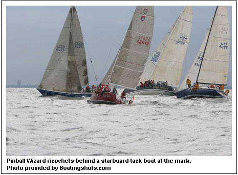 Pinball Wizard ricochets behind a starboard tack boat at the mark. Photo provided by Boatingshots.com