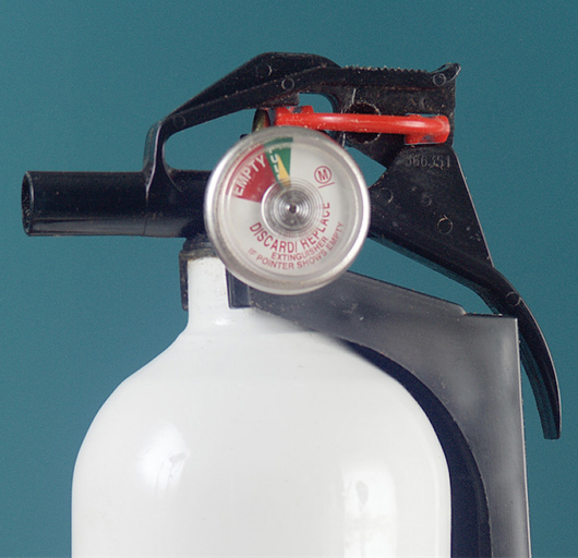 Look closely – is this fire extinguisher ready to put out a fire and does it meet US Coast Guard requirements?
