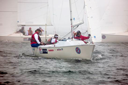 Rick Doerr (far left) with crew Brad Kendell (left), Hugh Freund (right) and Lindsay Smith (background) won in the Sonar class. Photo credit: Clagett/Thornton Cohen.